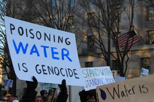 Poisoning_water_is_genocide_-_Stand_with_Standing_Rock.jpg